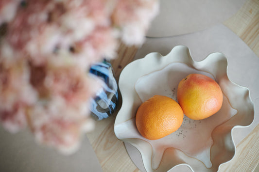 Two different-sized oranges, depicting uneven breasts