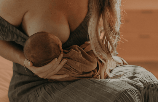 A woman breastfeeding her baby