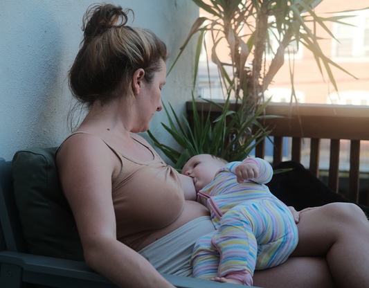 woman breastfeeding her baby